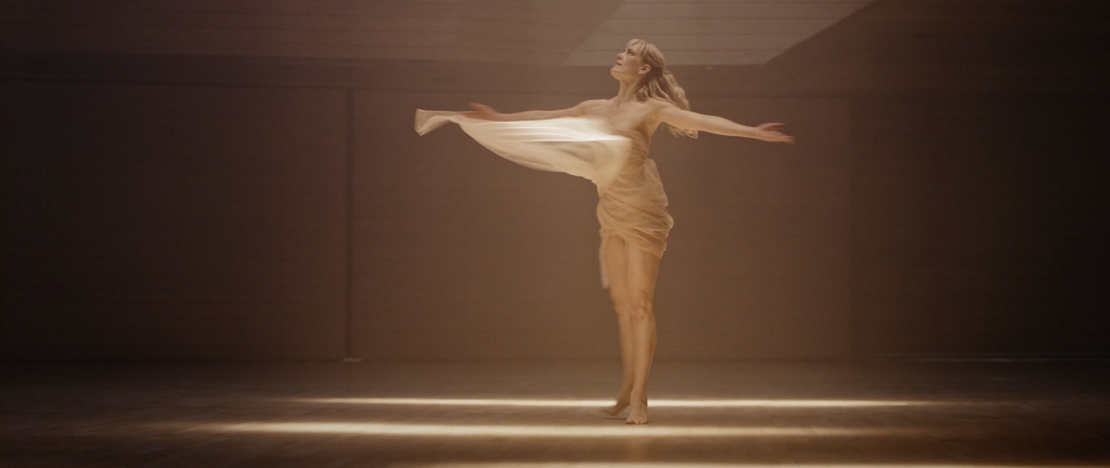 Dancer in flowing cloth performing Harvia's Healing with Heat artistic exploration